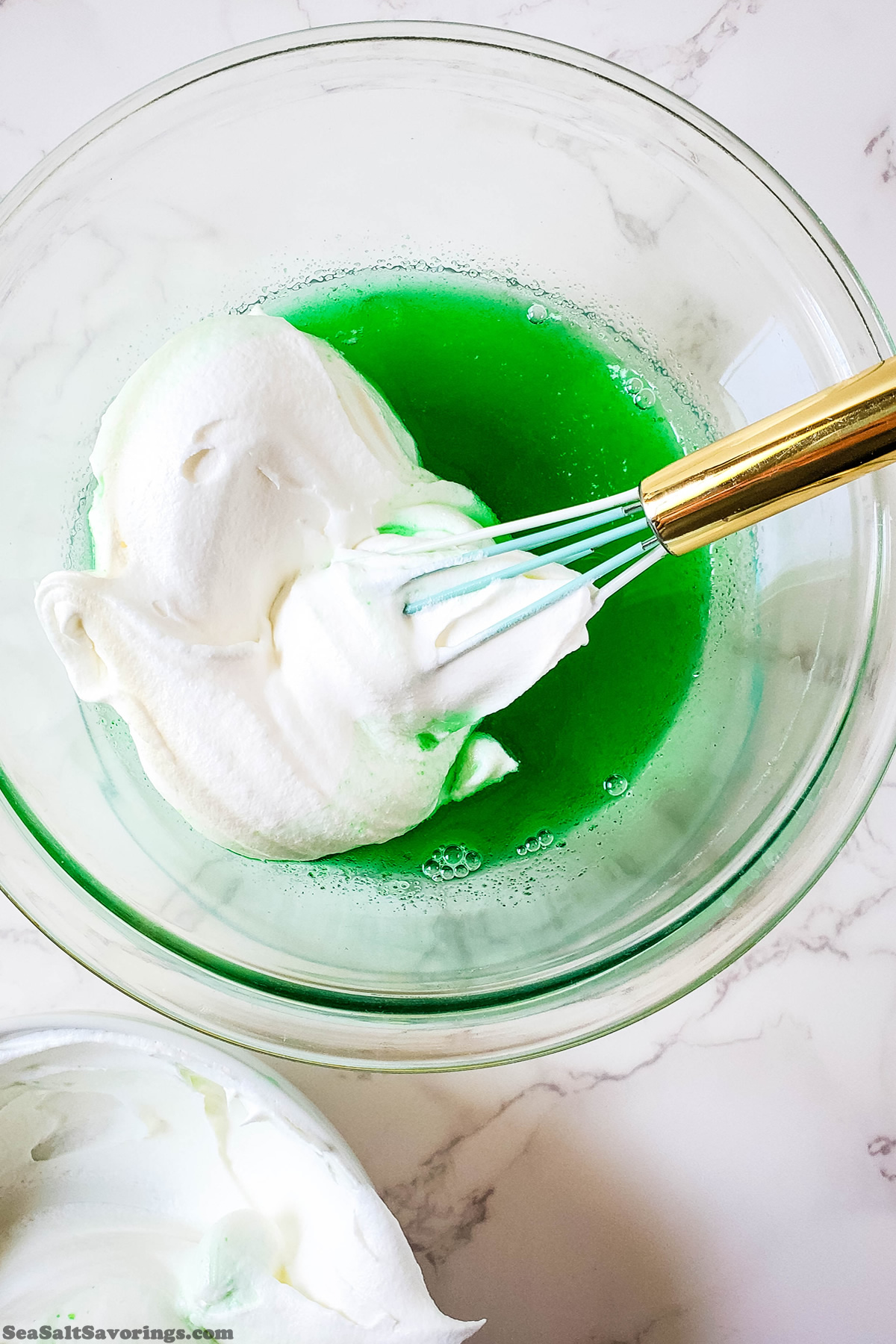 mixing whipped cream in with jello mixture